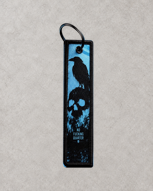 NFQ division tag on pale textured background