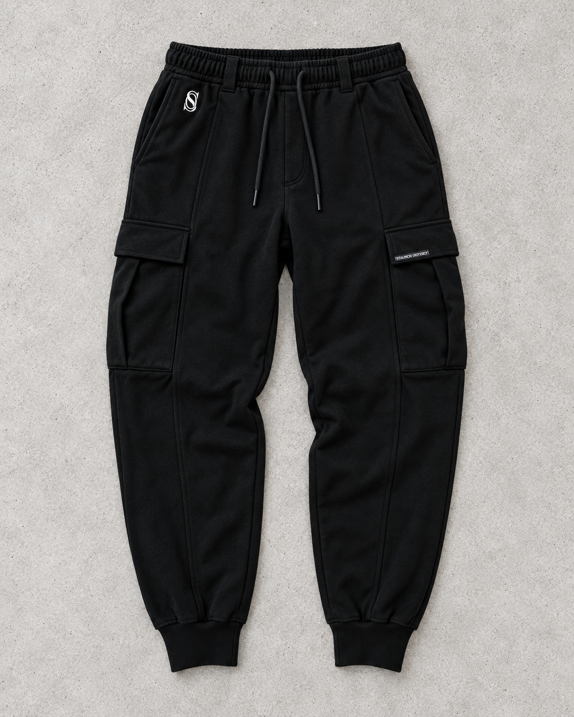 Steadfast black cargo sweats front flat-lay with SO hip logo and woven cargo-pocket label