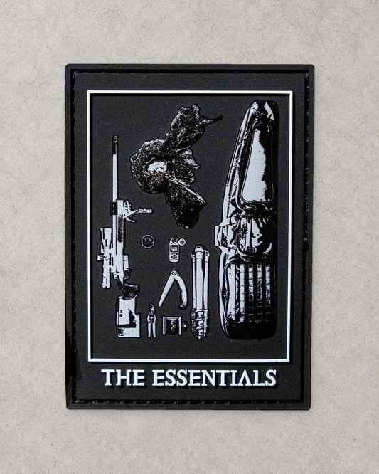 The Essentials patch on a pale textured background